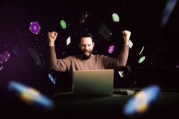 A man celebrating a winning moment on his laptop while gaming symbols float around him, capturing the excitement of 2G778 games.