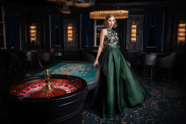 2G778 Mobile Casino — Play anytime, anywhere A player using their smartphone during a festive local event, representing 2G778’s fully mobile-friendly casino.